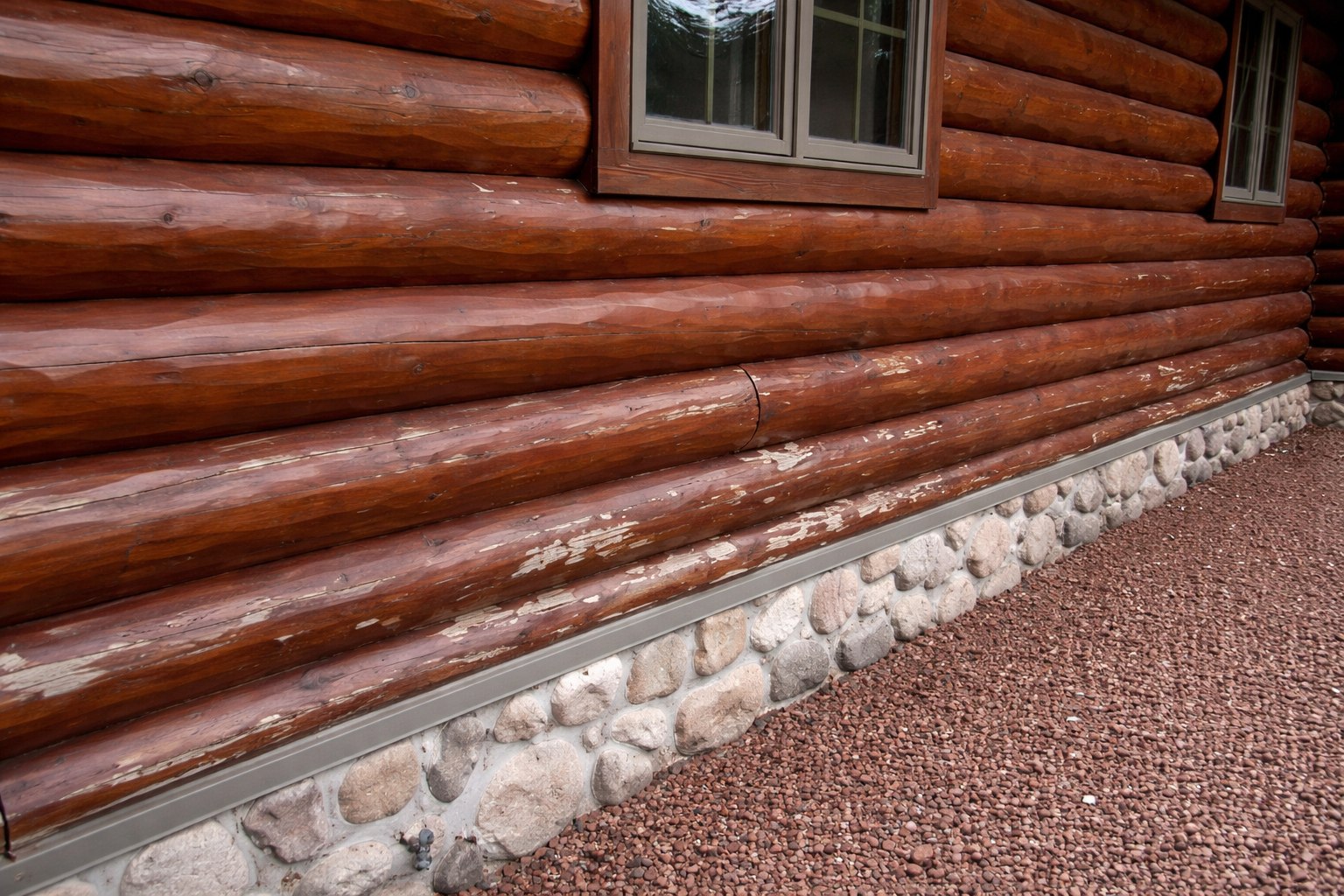 Log home with peeling stain before restoration — Ozarks MO